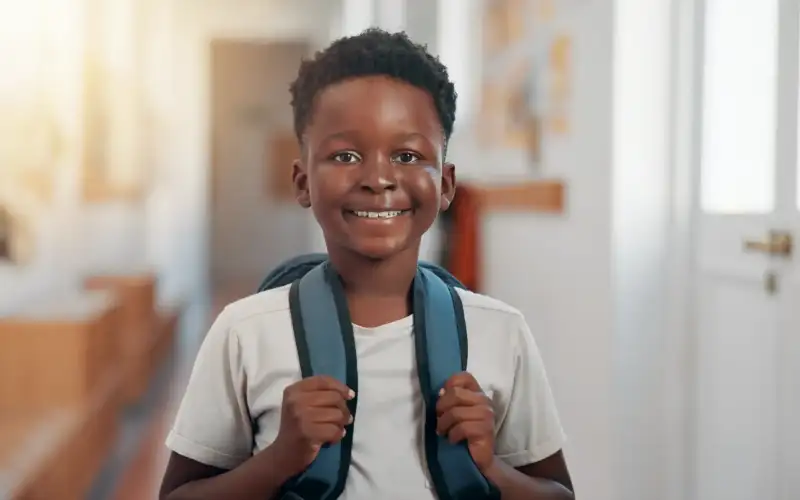 smile-backpack-and-portrait-of-black-child-in-sch-2026-01-09-09-41-42-utc